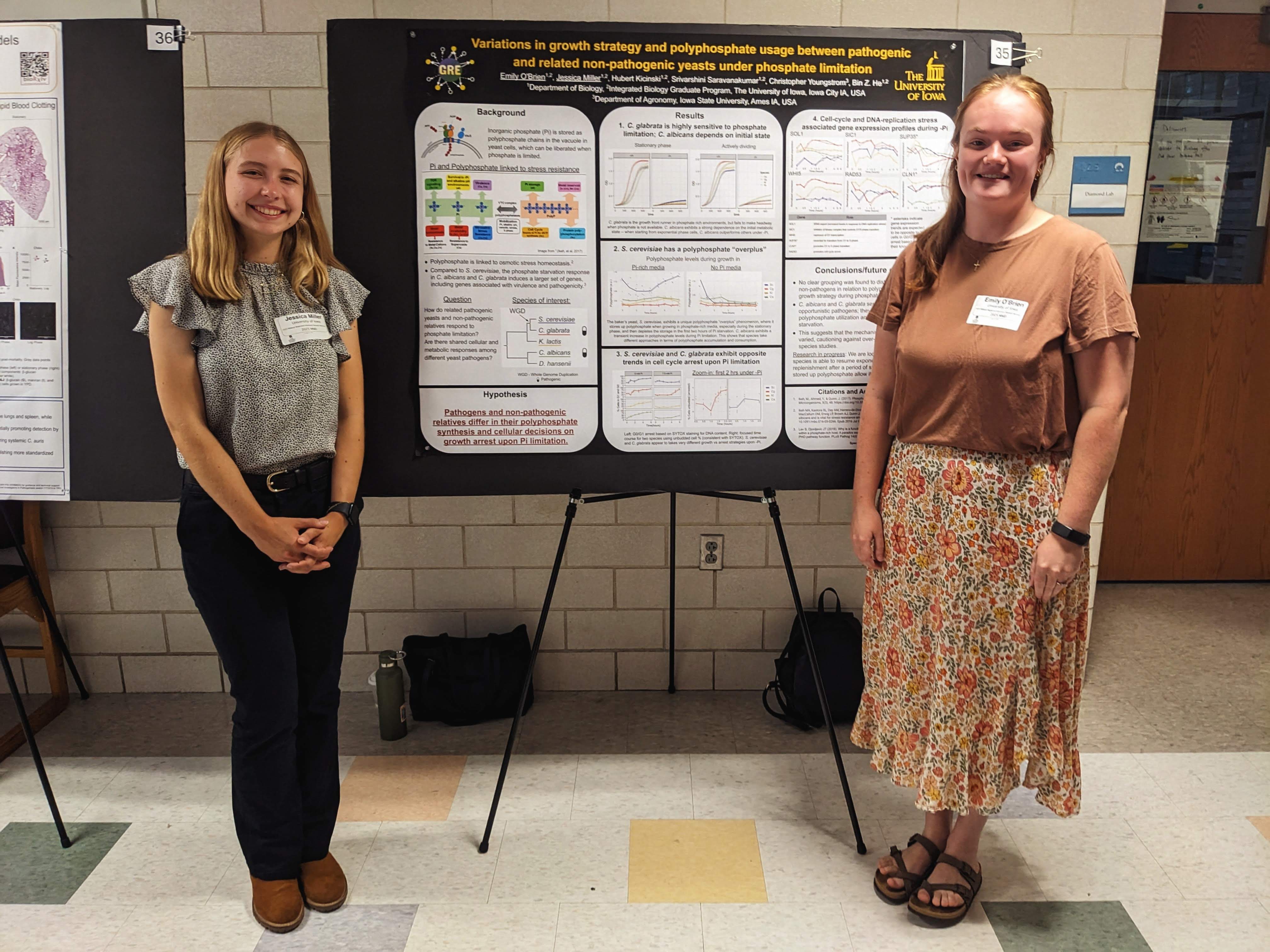 Emily and Jess presenting their research poster at the MNID meeting