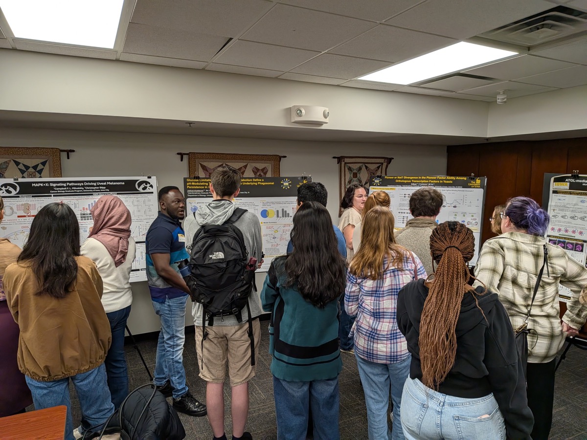 Conversations around the lab's posters at the Biology retreat